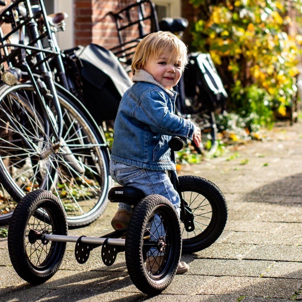 boy in denim riding TryBike - Steel 2 in 1 Balance Trike Bike - Black