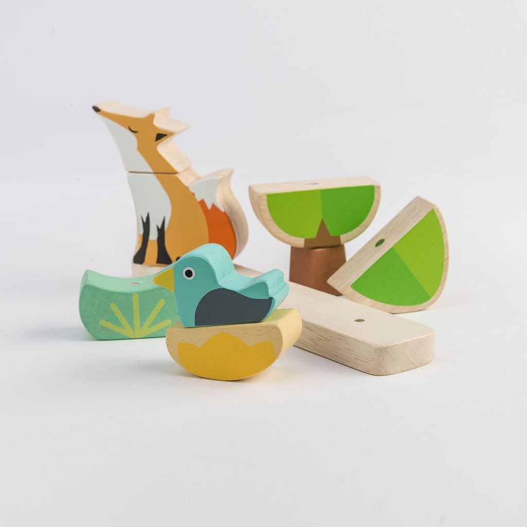 close up of wooden toys from ThreadBear Fox Magnetic Stacker & Where's Baby Activity Book