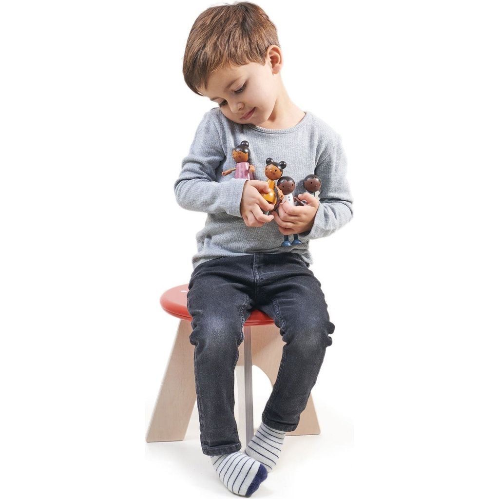 boy holding Tender Leaf Hummingbird Doll Family
