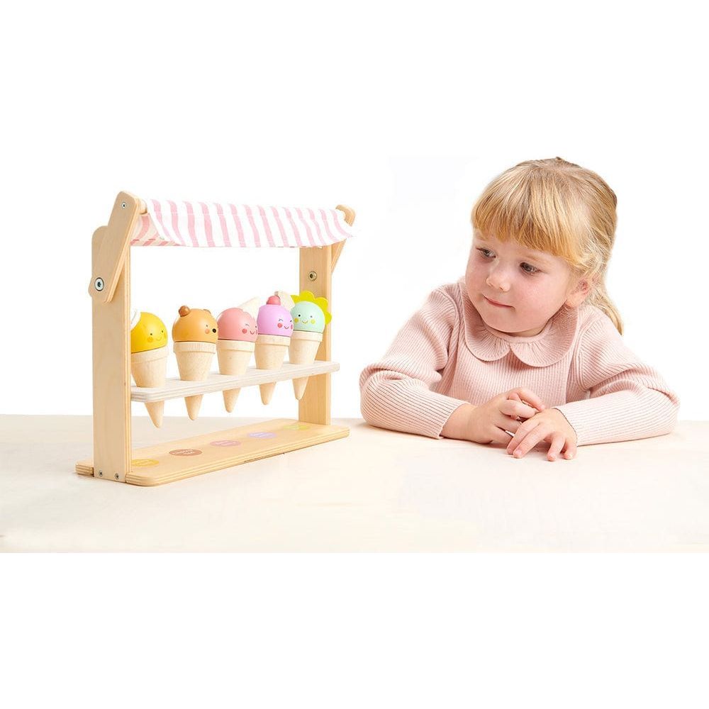 girl playing with Tender Leaf Scoops and Smiles Wooden Ice Cream Set