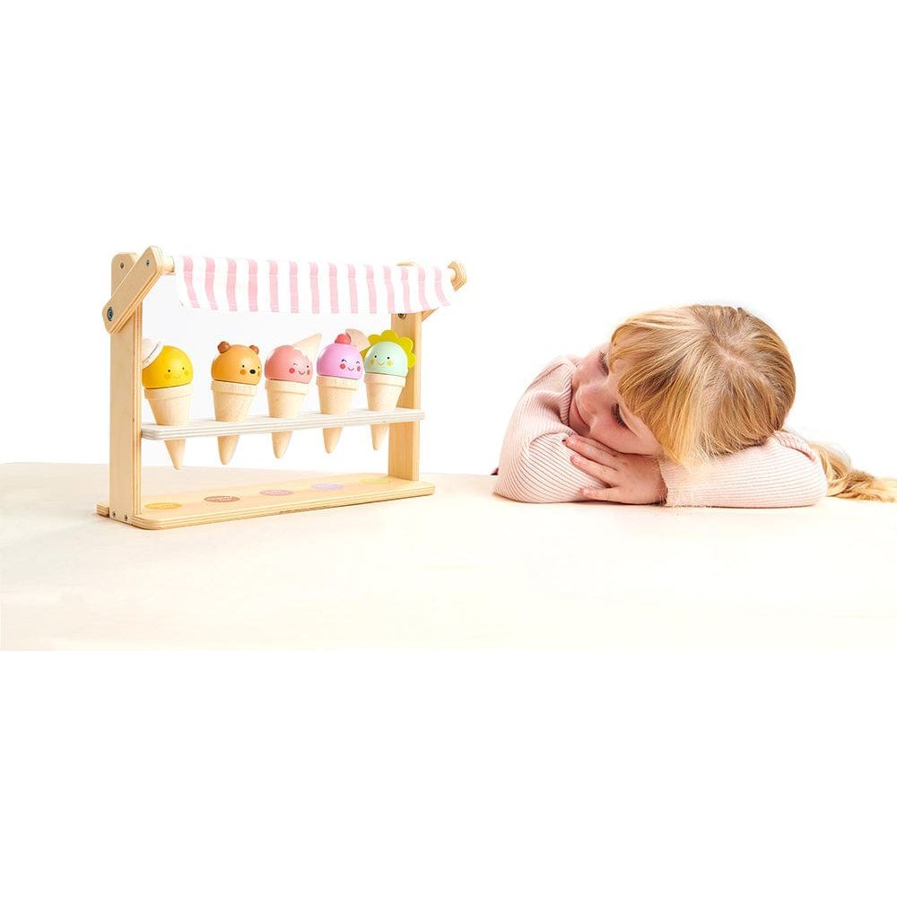 girl looking at Tender Leaf Scoops and Smiles Wooden Ice Cream Set