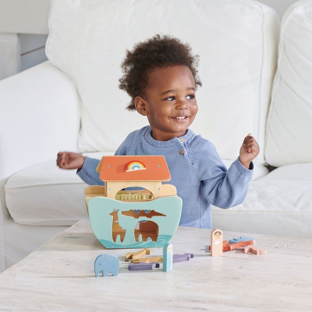 child playing with Tender Leaf Little Noah's Ark Wooden Set