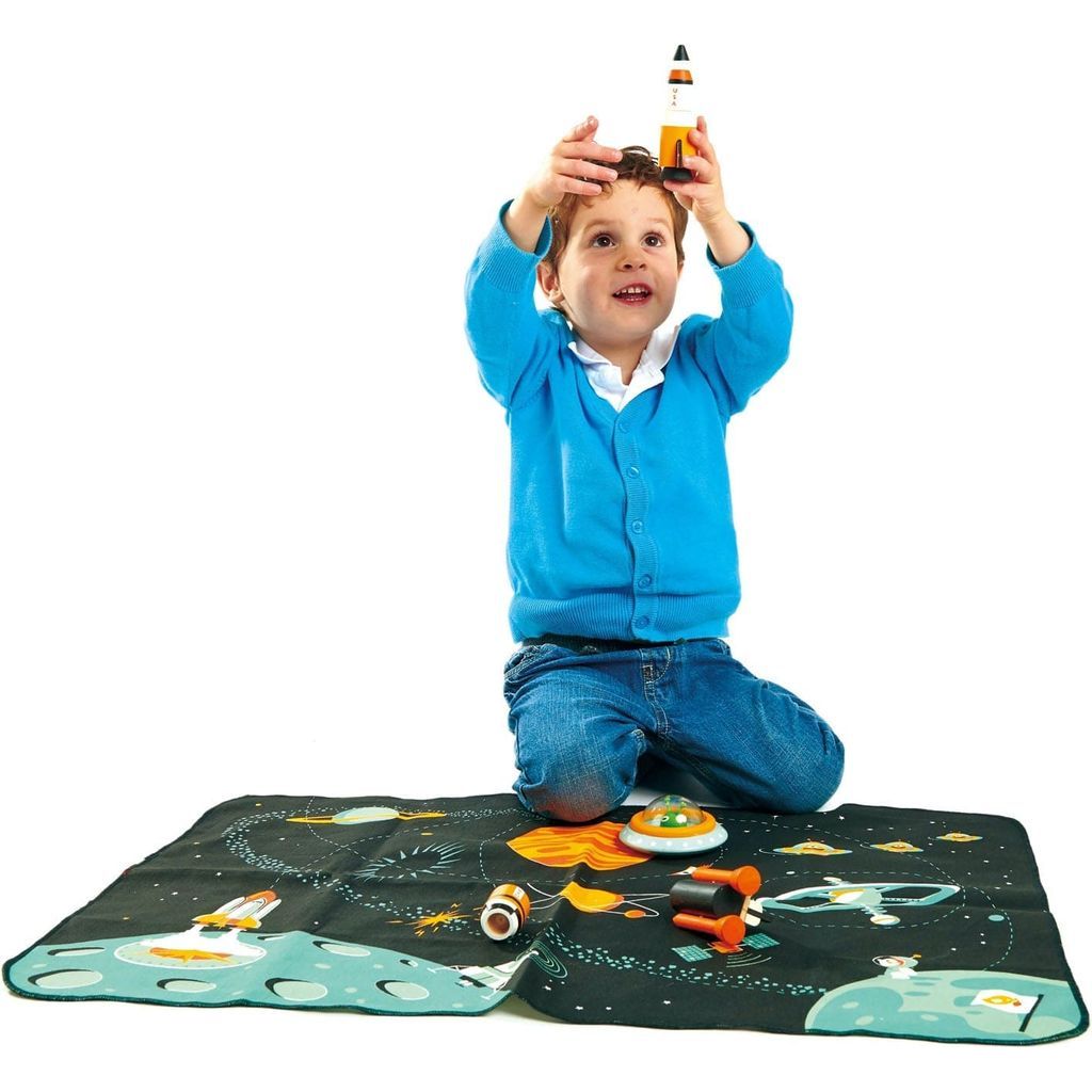 boy playing with shape shuttle from Tender Leaf Space Adventure Play Mat