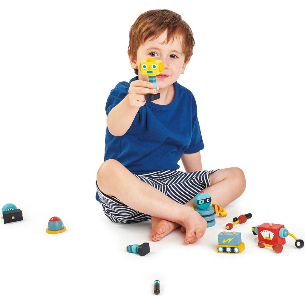 boy holding Tender Leaf Robot Construction Wooden Figures