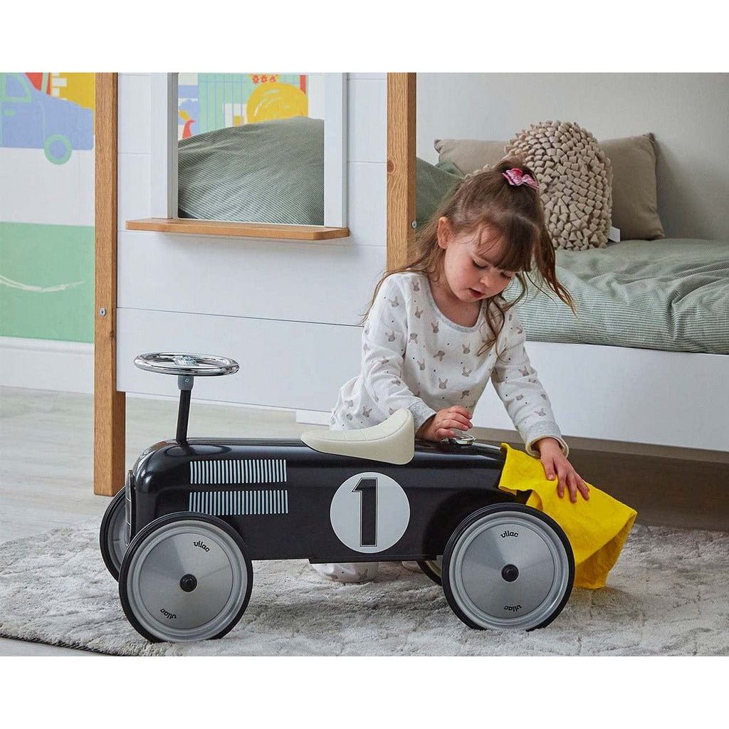 little girl polishing Vilac Classic Ride On Car - 18m+ - Black