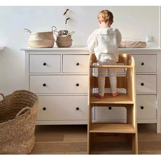 child standing on Curve Lab Learning Curve Learning Tower