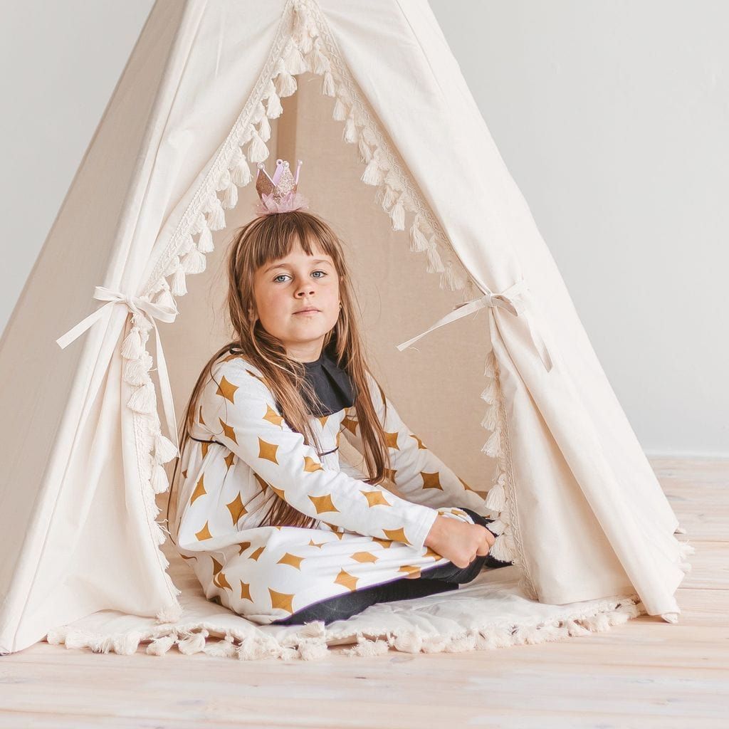 girl sitting in MINICAMP Boho Kids Teepee With Tassels