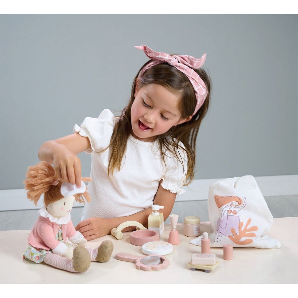 girl playing with Tender Leaf Wooden Toy Spa Retreat Set and doll