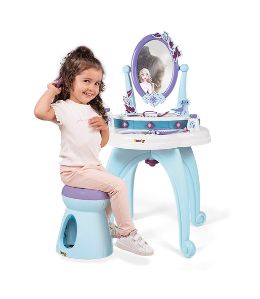 girl sitting at smoby frozen dressing table