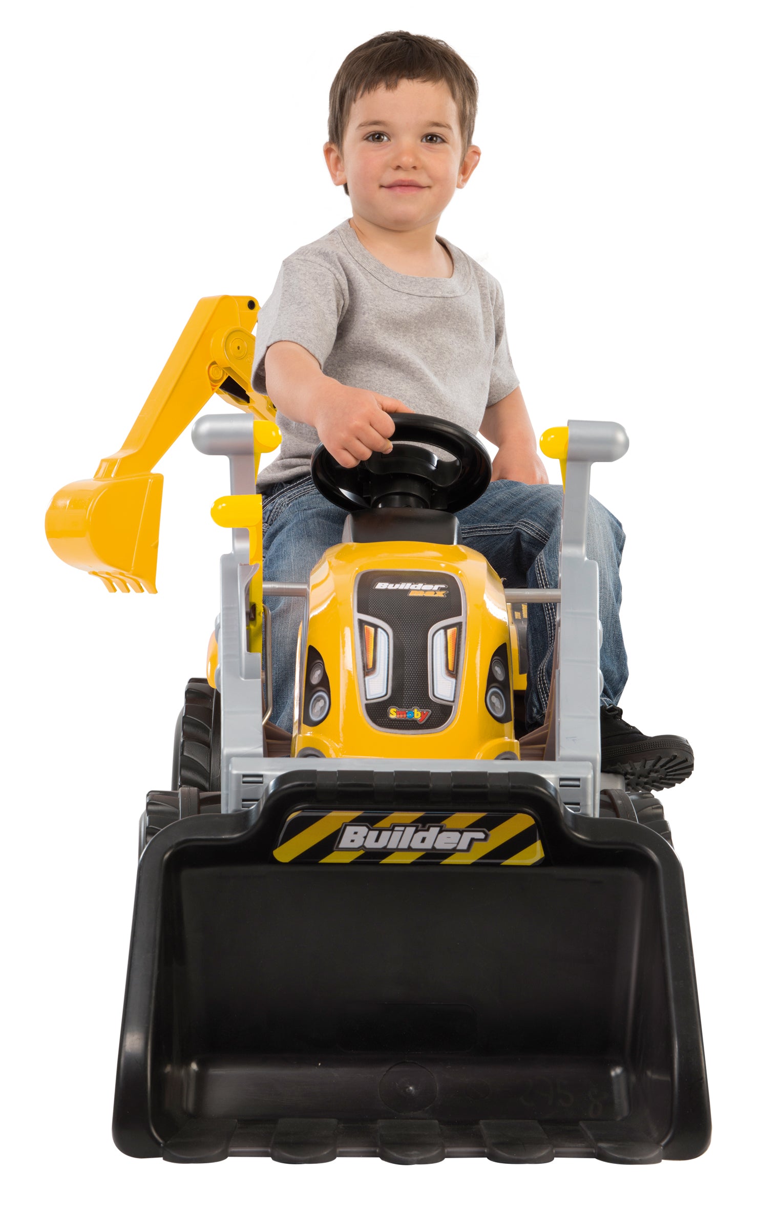 boy sitting on smoby builder max ride on
