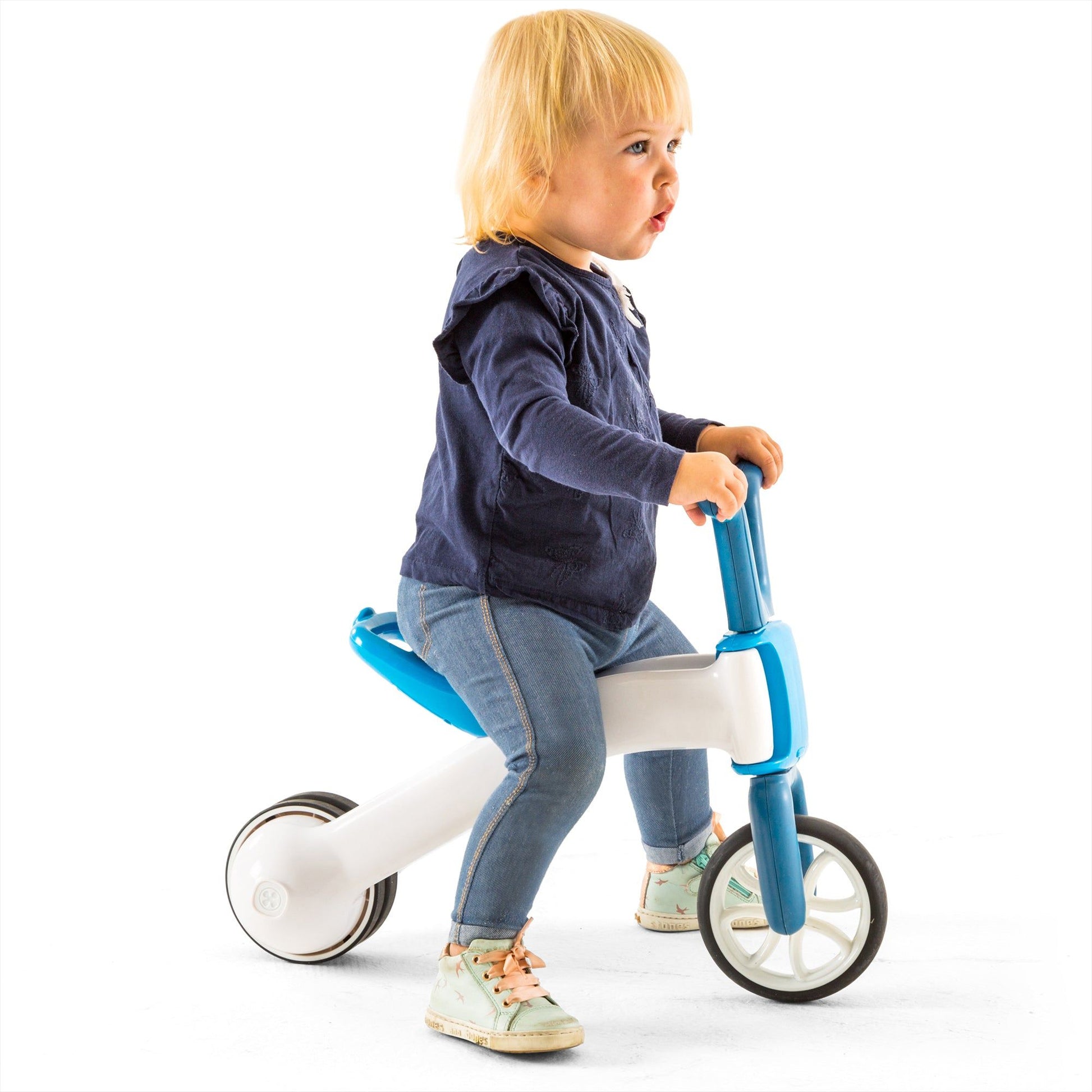 child riding Chillafish BUNZI Trike Blue 