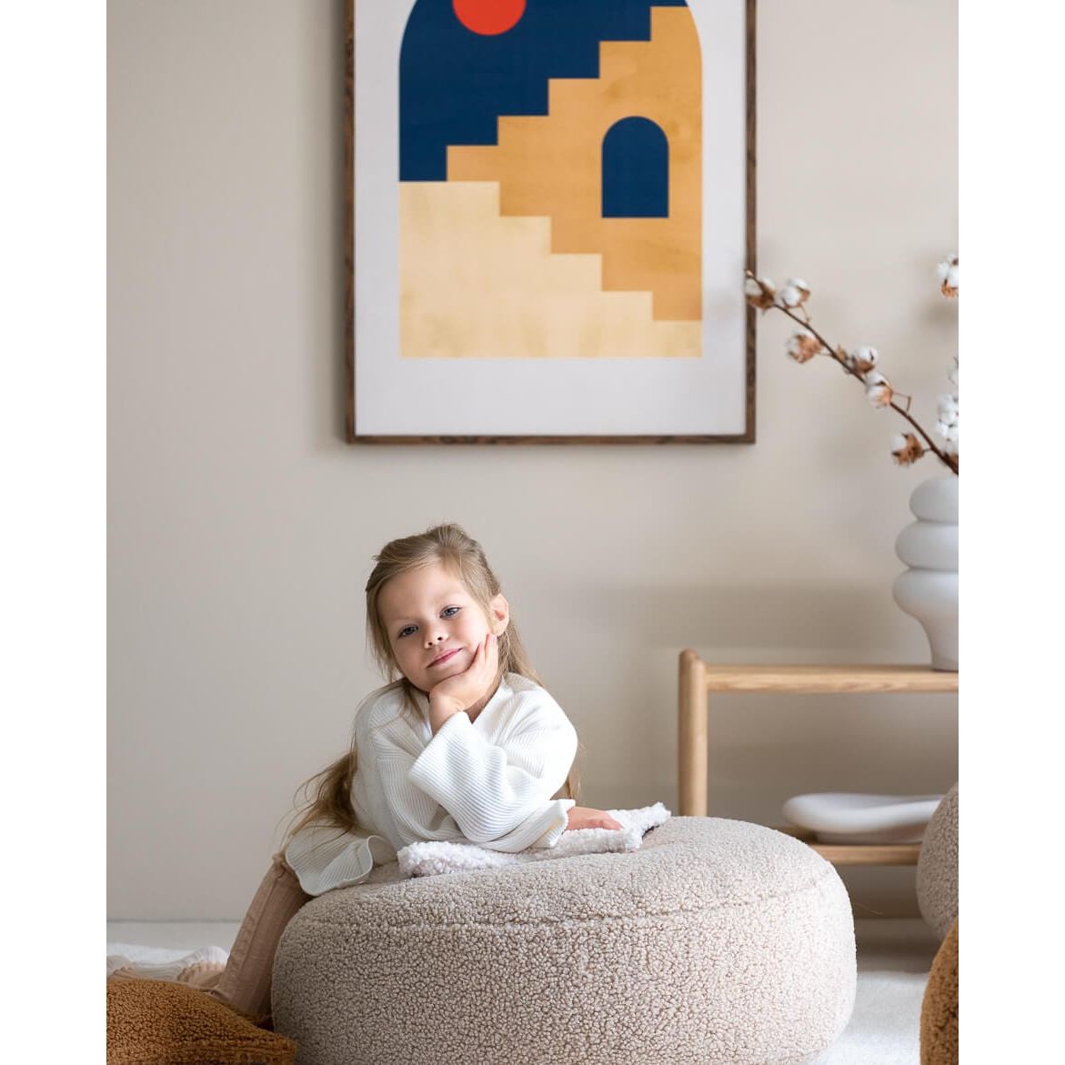 girl leaning on Wigiwama Biscuit Ottoman