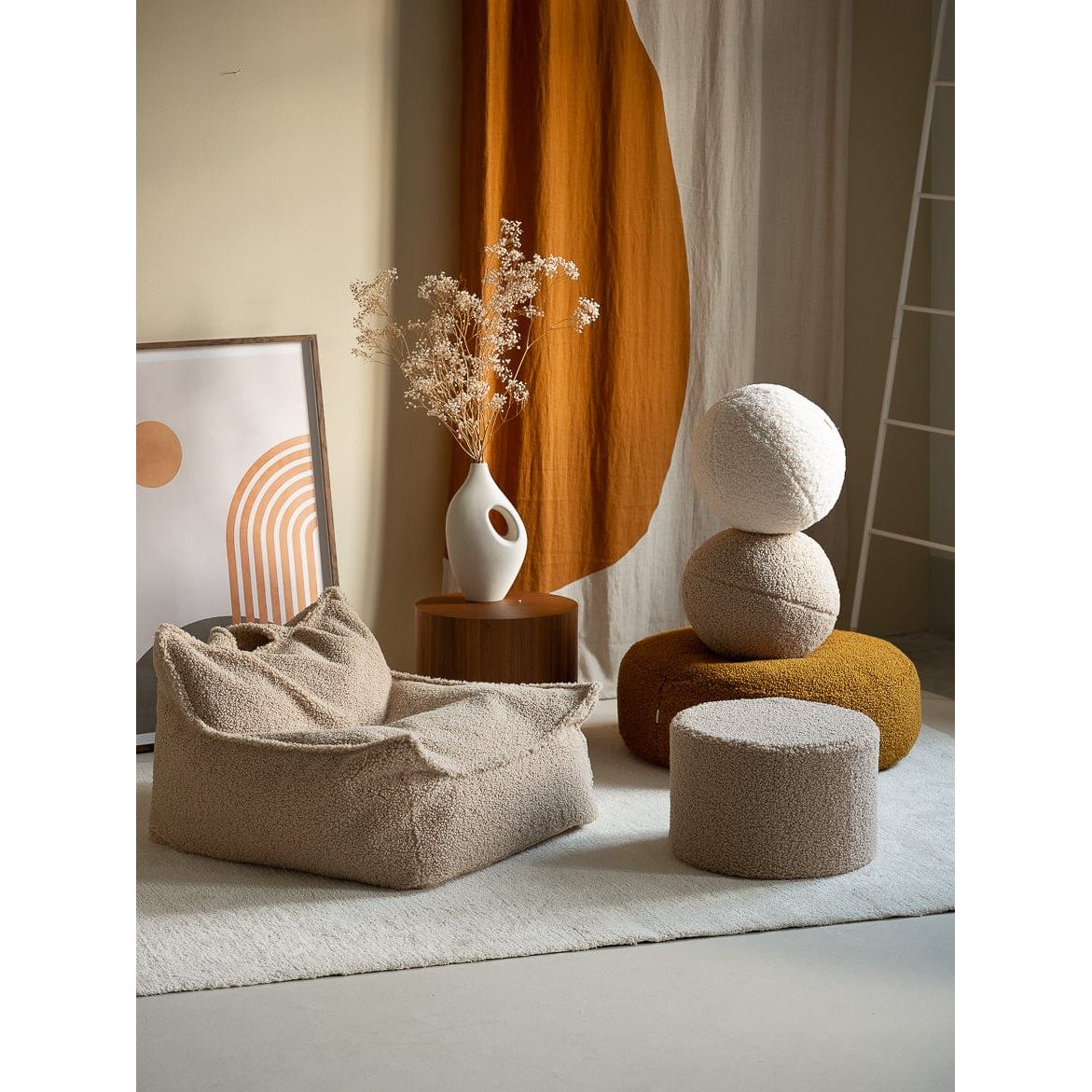 Wigiwama Biscuit Ball Cushion in room with beanbag chair and pouffe
