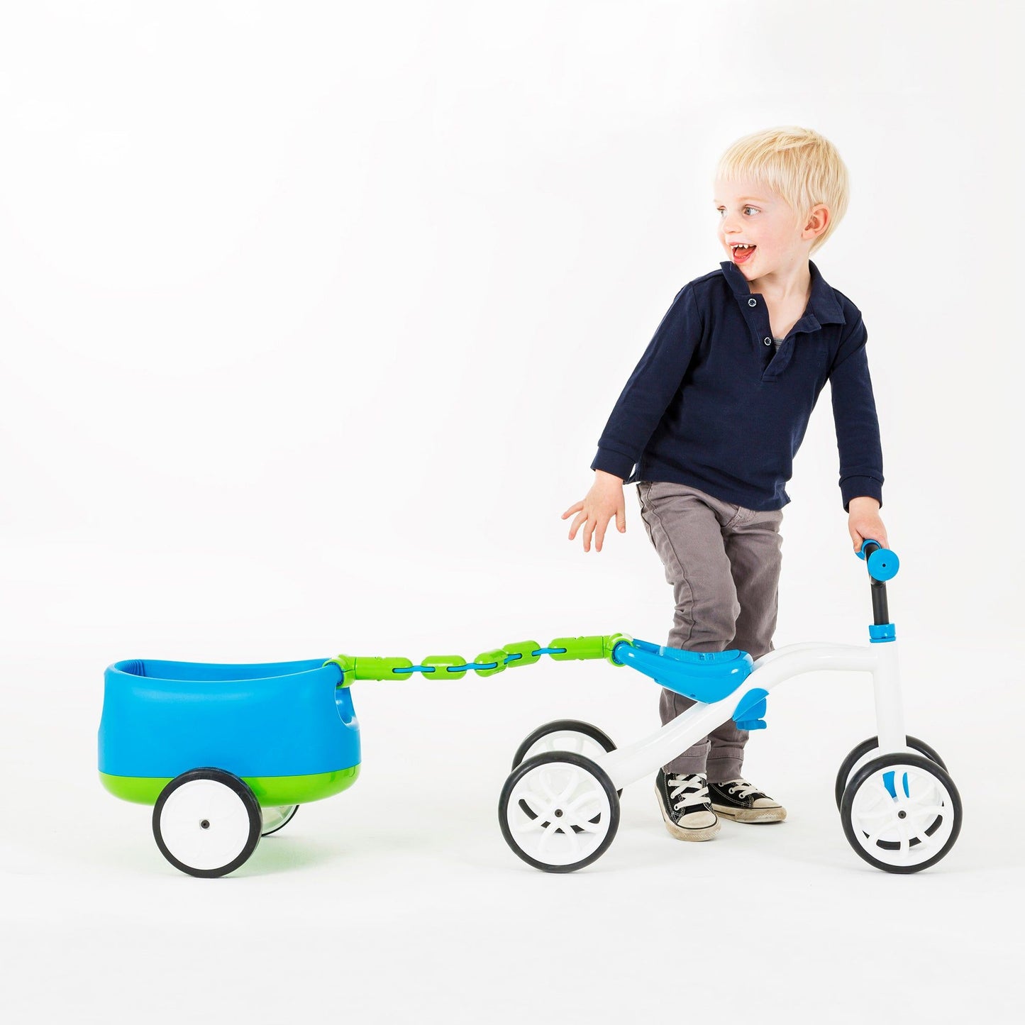 boy with Chillafish Quadie and Trailie Ride-On Blue