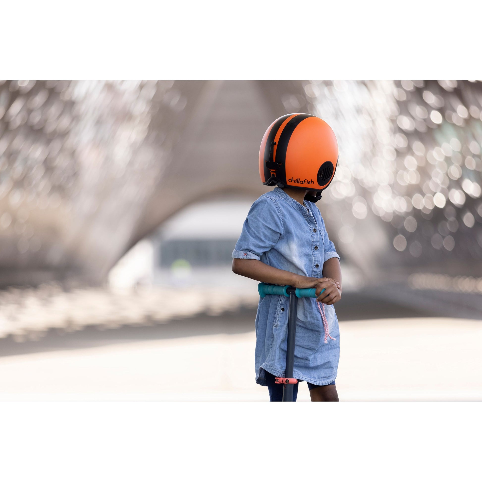 child wearing Chillafish Helmet Bobbi Small Orange
