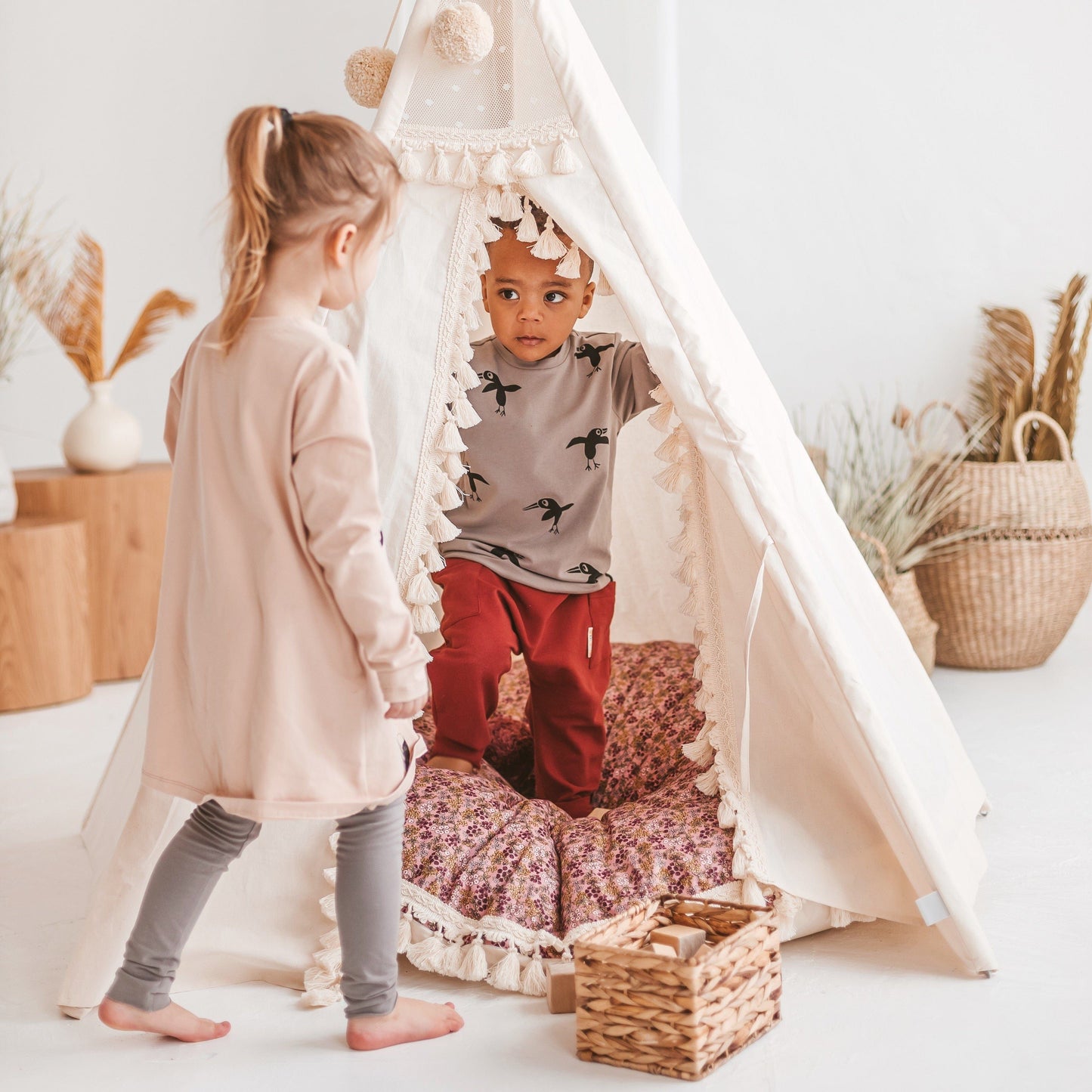 boy and girl playing in MINICAMP Boho Kids Teepee With Tassels