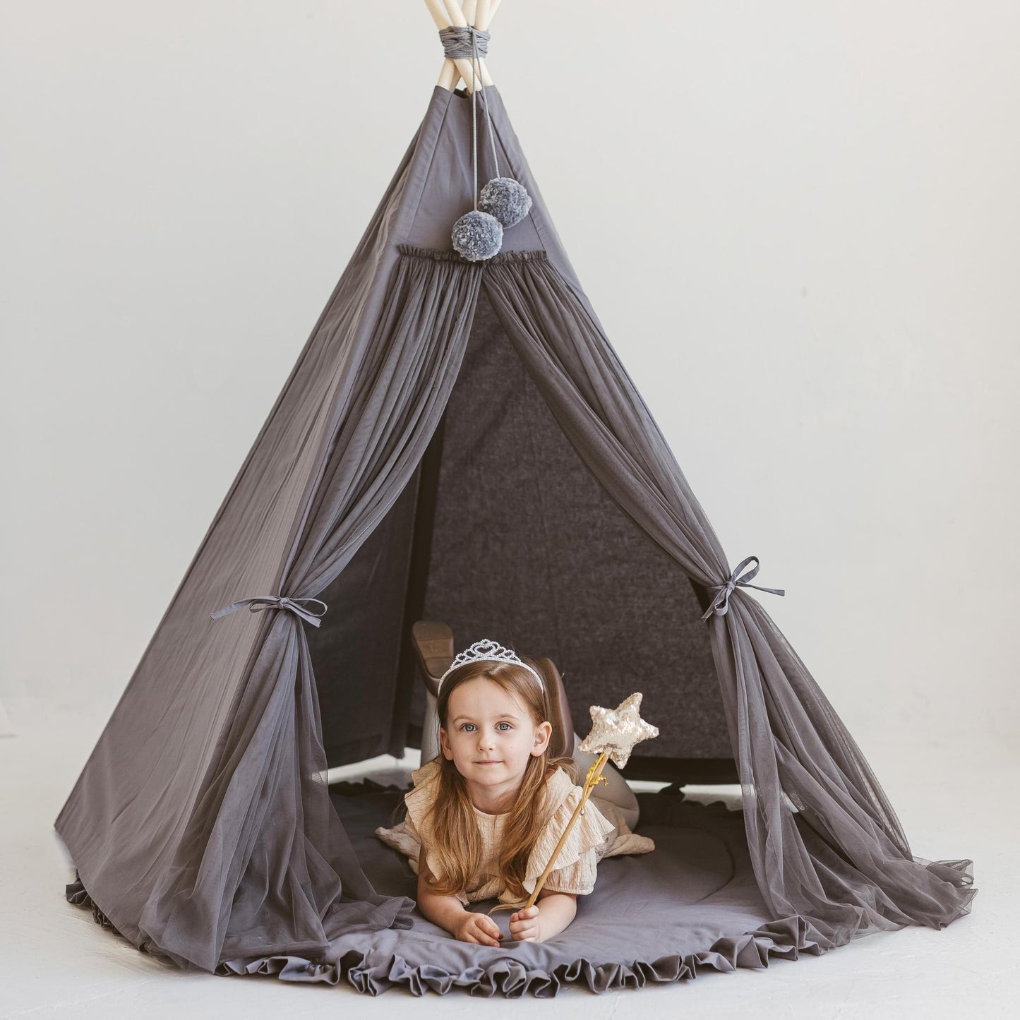 girl lying in MINICAMP Fairy Kids Play Tent in Grey