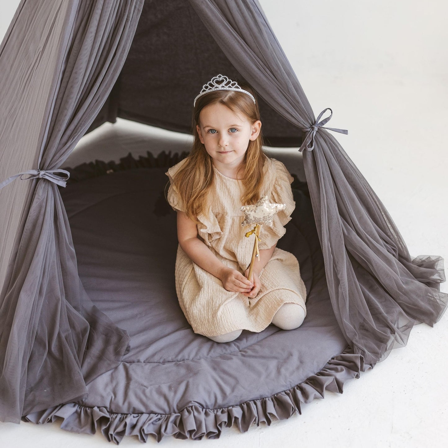 close up of girl with wand kneeling in MINICAMP Fairy Kids Play Tent in Grey