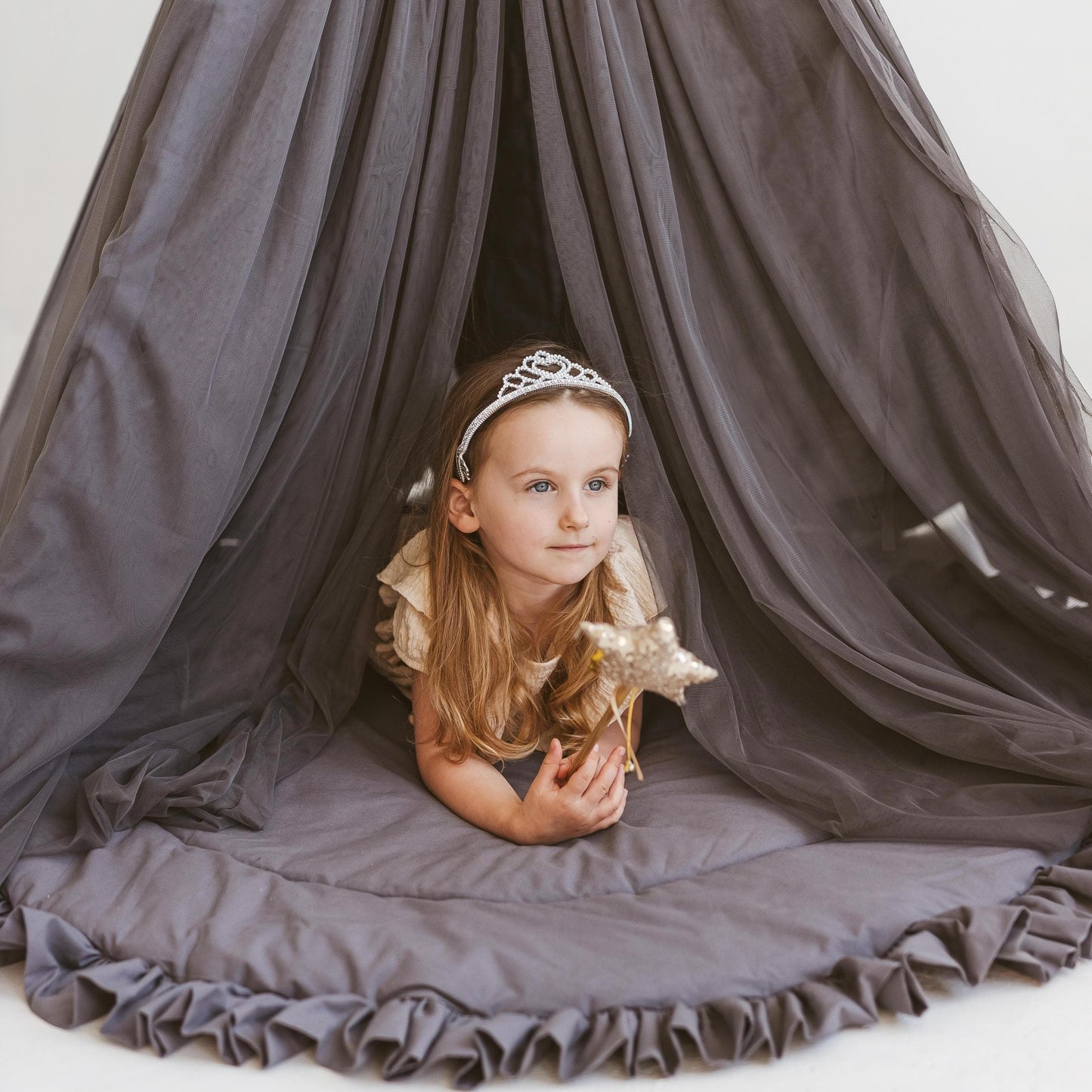 girl with wand lying in MINICAMP Fairy Kids Play Tent in Grey