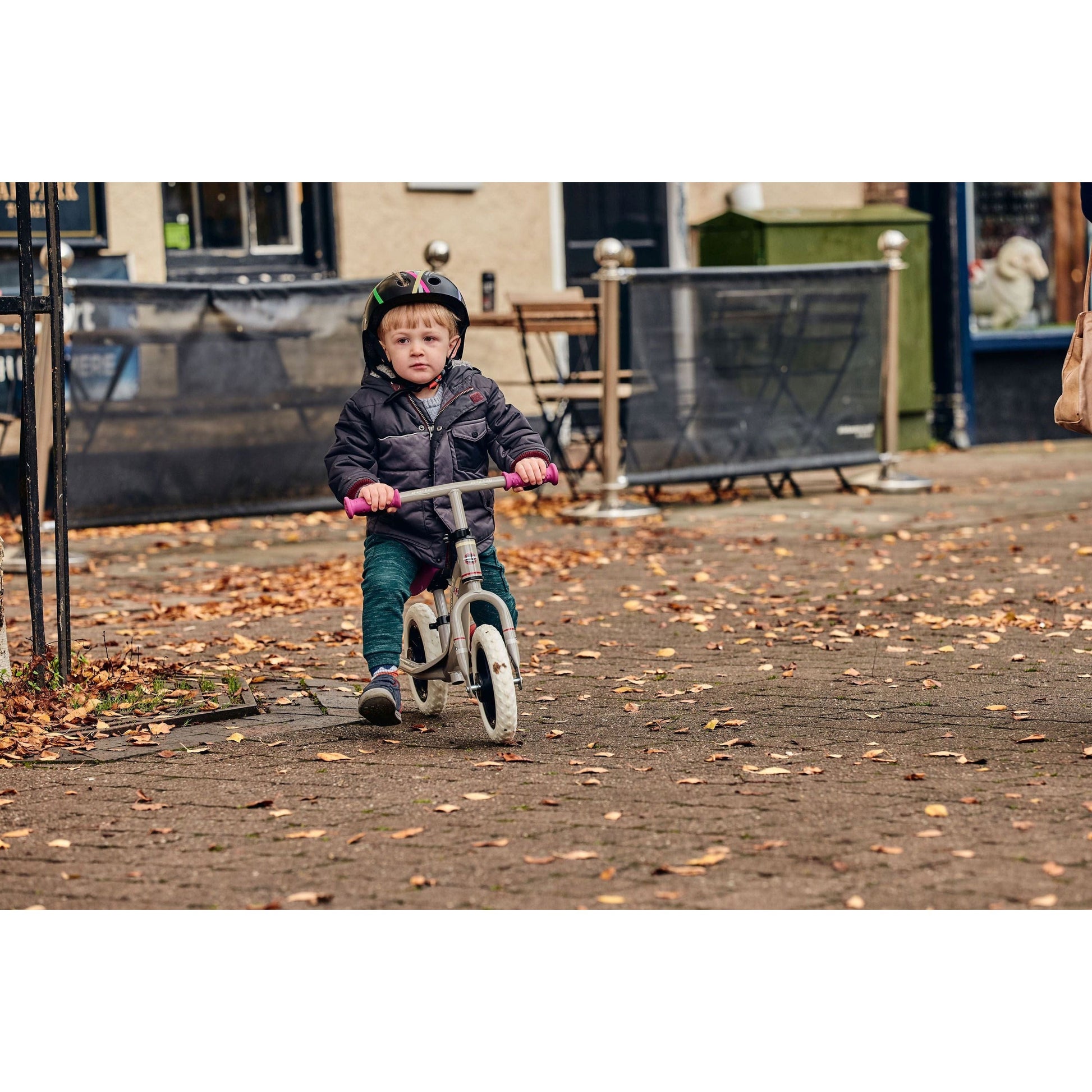 boy riding Ride-Ezy Go Balance Bike - Pink & Silver