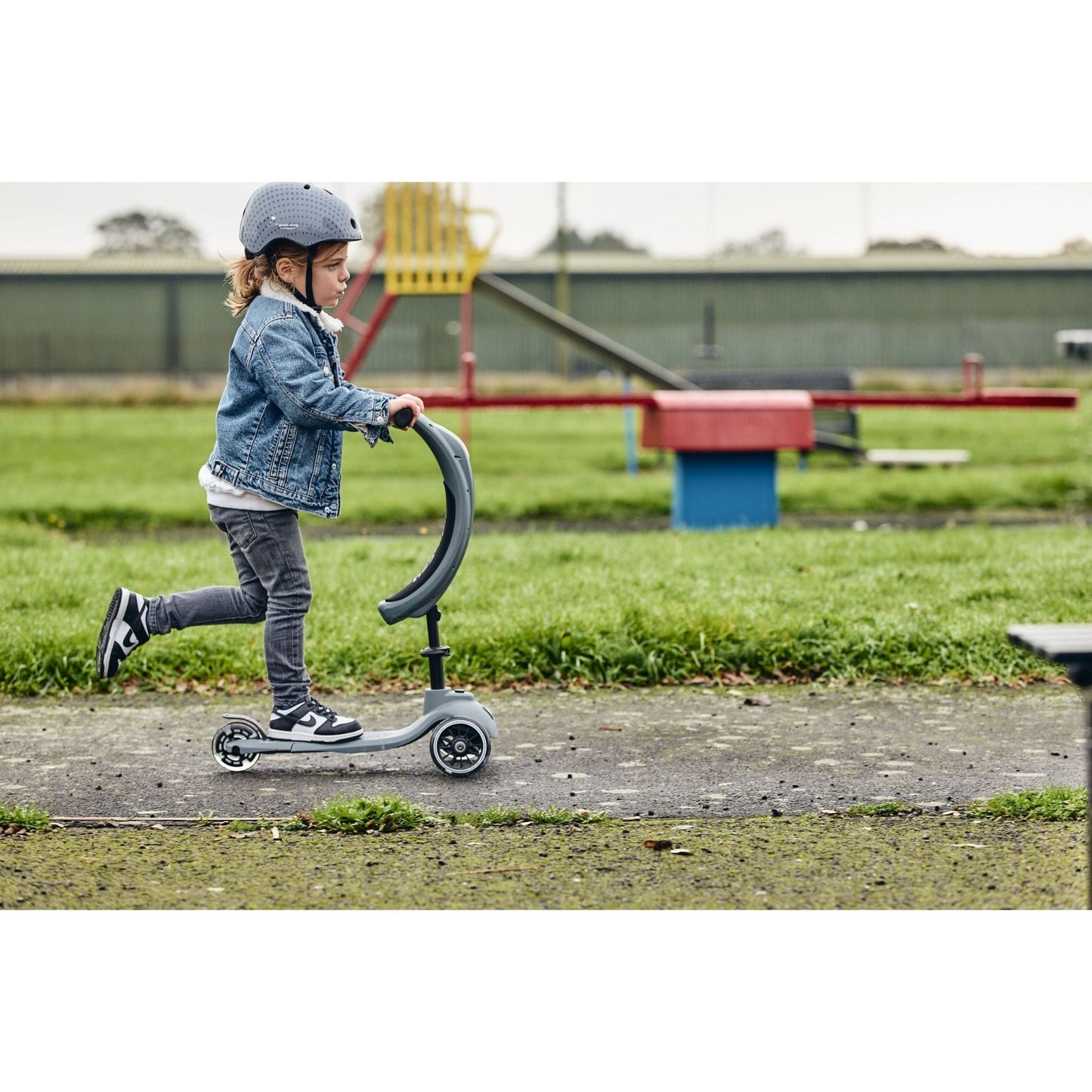 child riding Ride-Ezy Kick & Go Scooter - Thunder Cloud side view