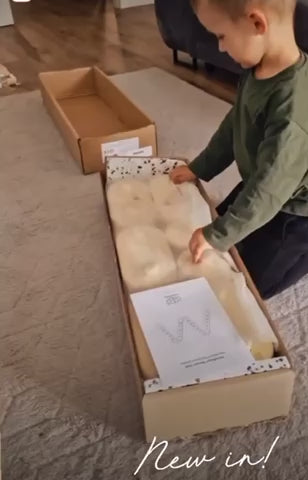 video of boy unboxing Wooden Balance Beam - 4 Piece Set