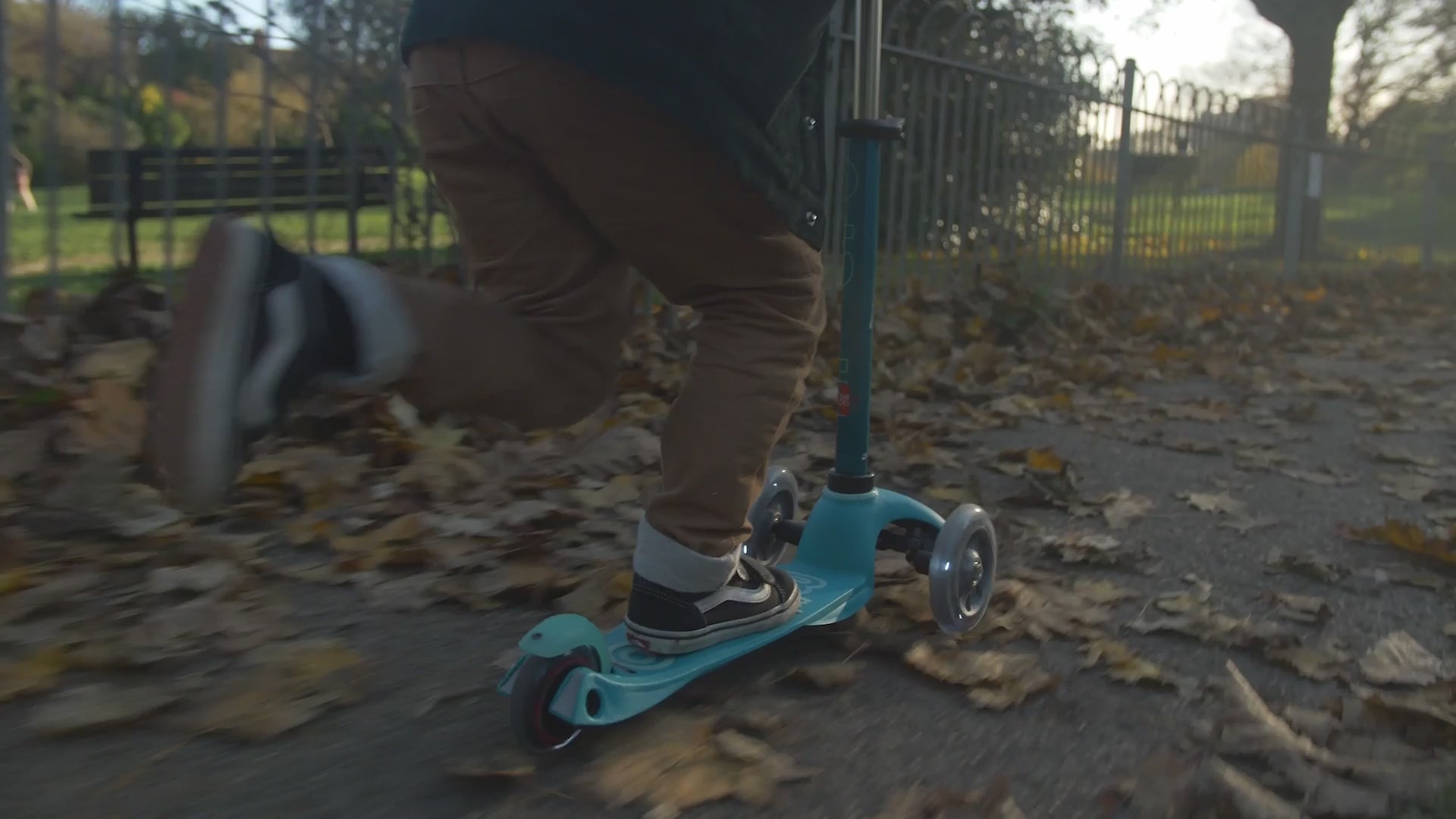 child riding Micro Scooter Mini Deluxe LED - Red