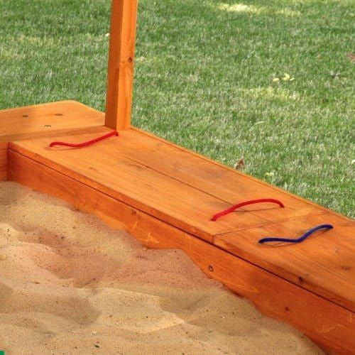 close up of seating area of KidKraft Outdoor Sandbox with Canopy