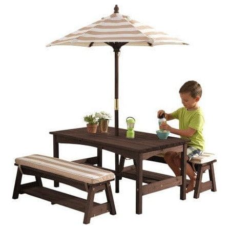 boy pouring frink at KidKraft Outdoor Table/Bench Set - Oatmeal & White Stripe