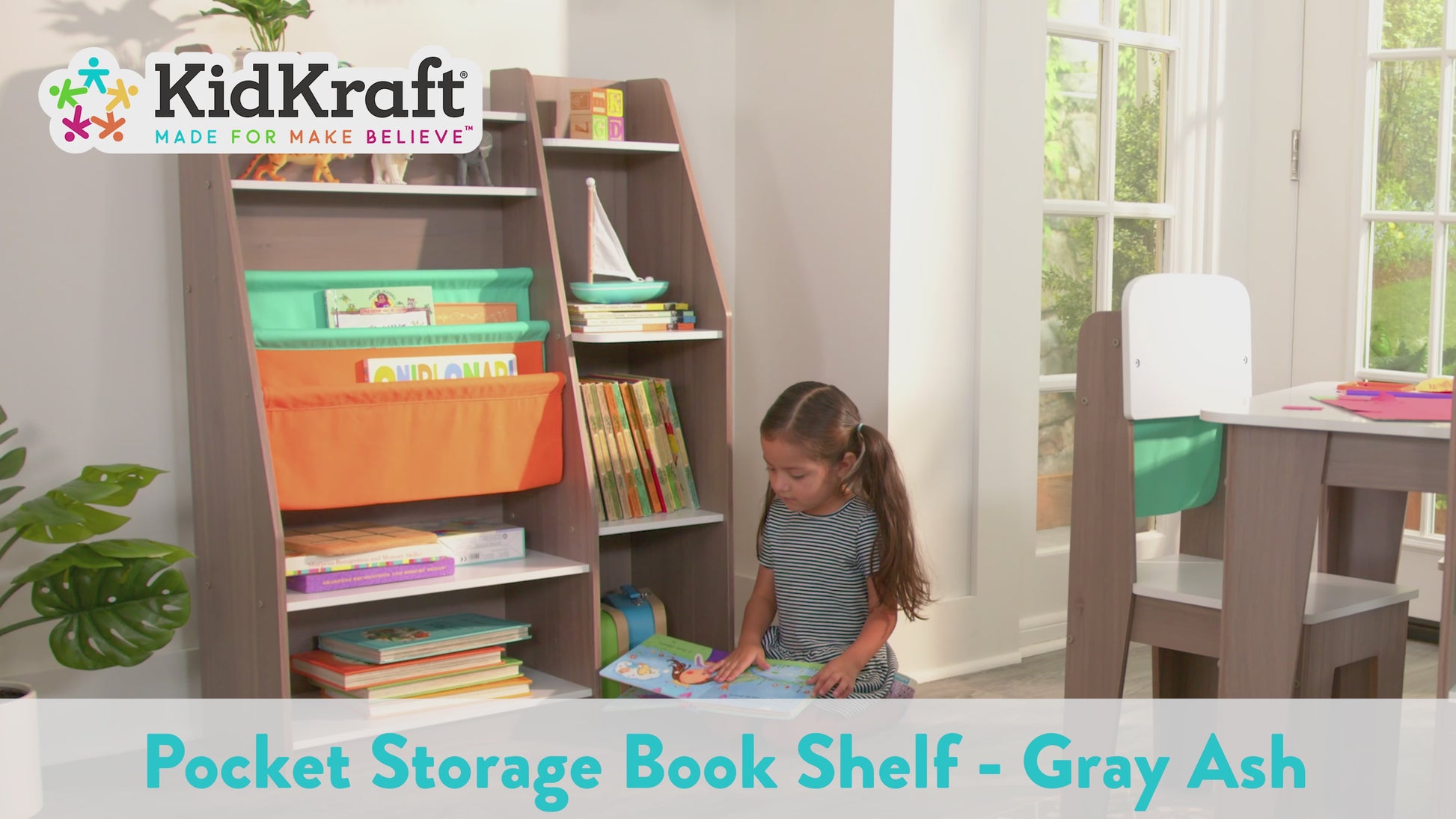 video of girl reading in front of KidKraft Pocket Storage Bookshelf - Gray Ash