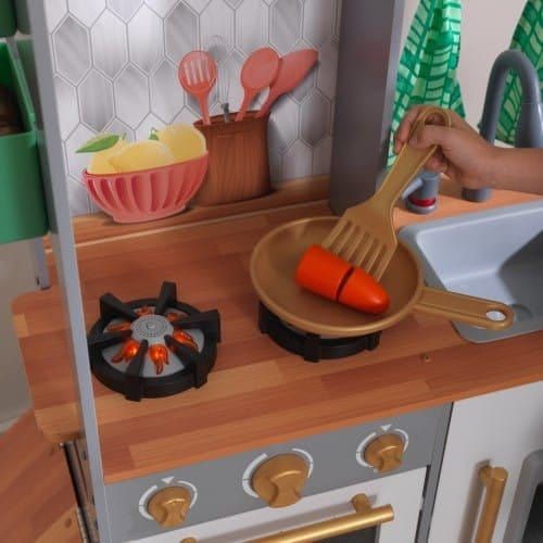carrots cooking on hob of Kidkraft Terrace Garden Play Kitchen