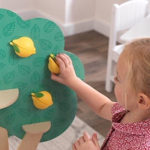 little girl picking lemons