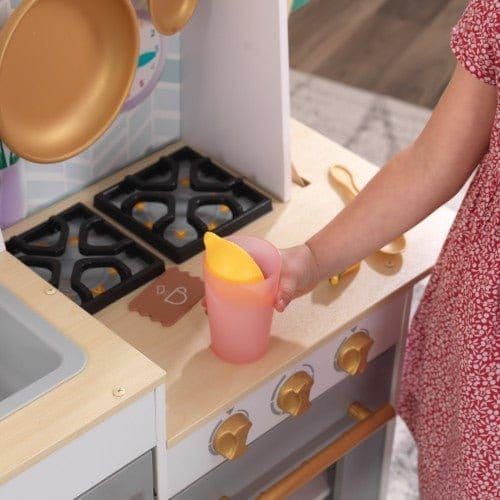 little girl halding cup at Kidkraft Happy Harvest Play Kitchen