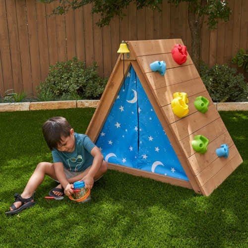 boy playing in front of KidKraft A-Frame Hideaway & Climber