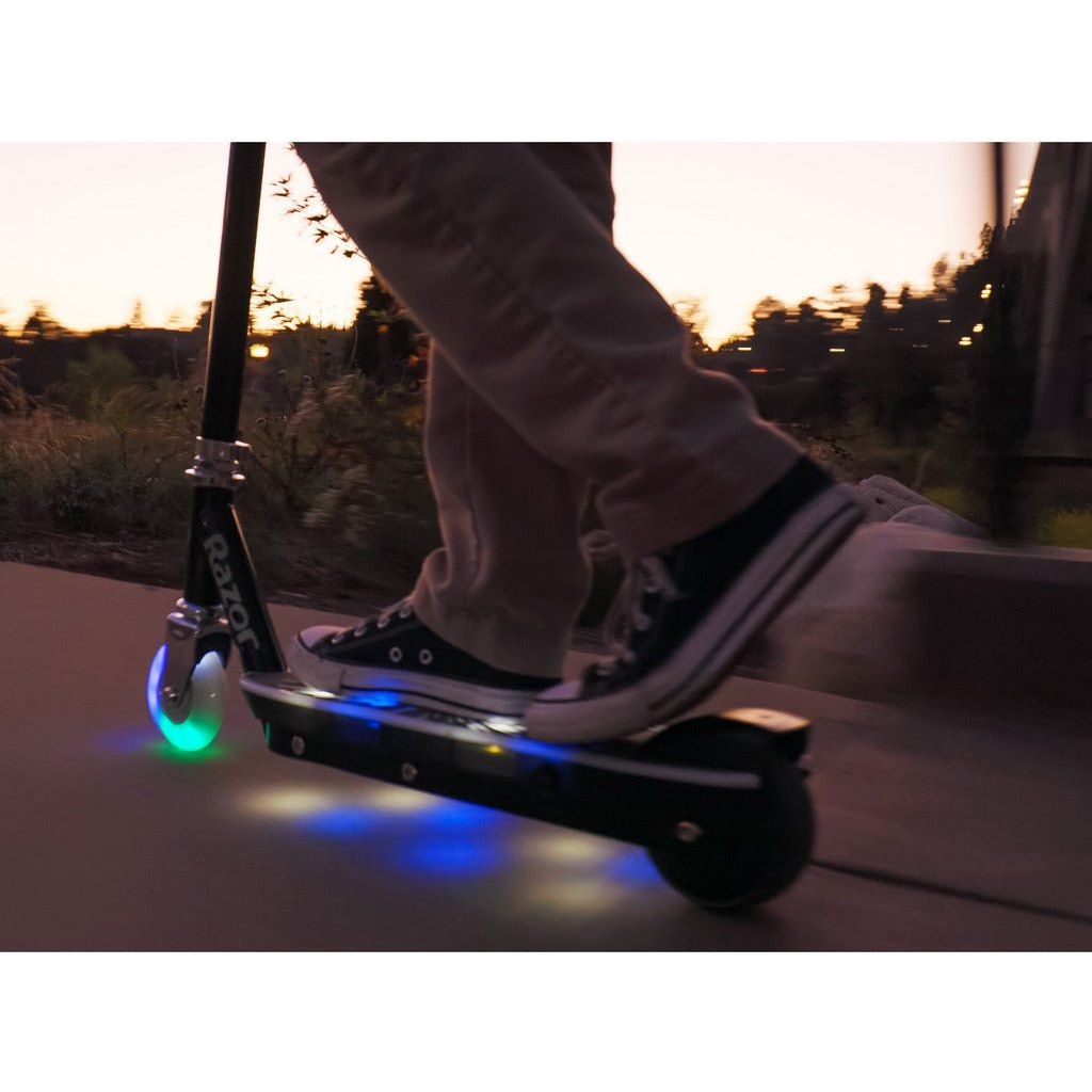 close up of Razor Electric Tekno 10.8V Lithium-ion Scooter - Black lights at night