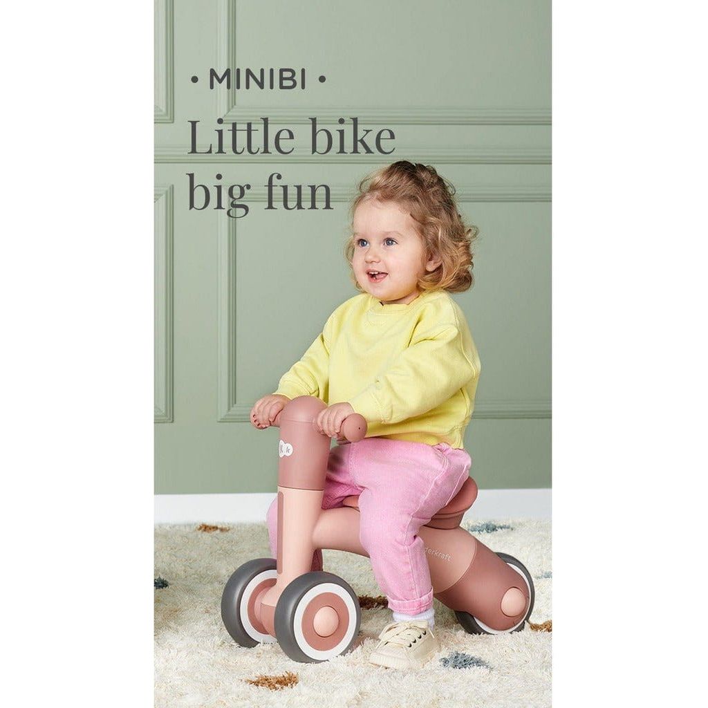 girl riding Pink Kinderkraft Minibi Tricycle