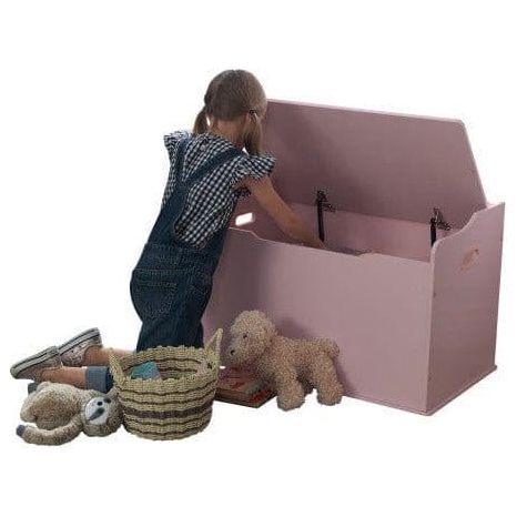 girl reaching into open KidKraft Austin Toy Box - Pink