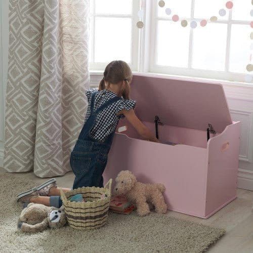 girl reaching into KidKraft Austin Toy Box - Pink