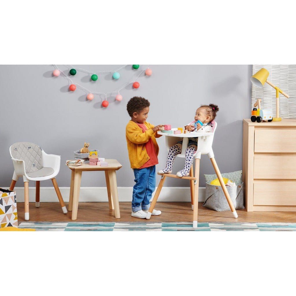 boy standsing by girl in Kinderkraft Sienna High Chair - Grey