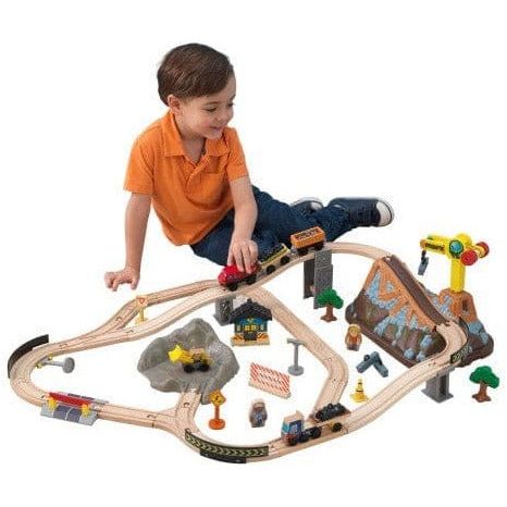 boy pushing train on KidKraft Bucket Top Construction Train Set