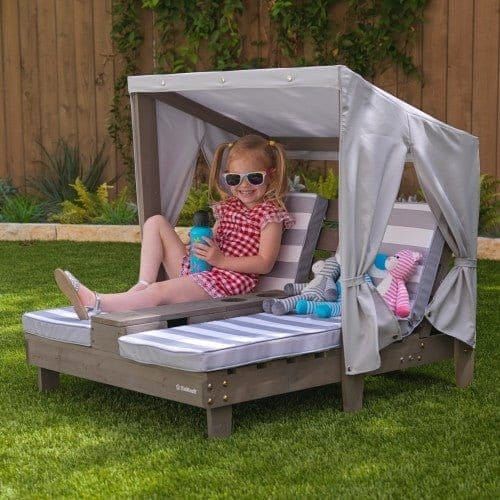 girl in sunglasses sitting on KidKraft Double Chaise Lounge with Cup Holders - Grey