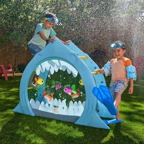 2 boys playing with KidKraft Shark Escape Climber with water spraying