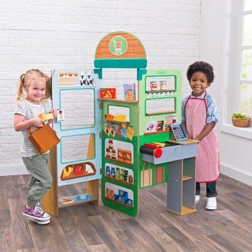 children with KidKraft Let’s Pretend™ Grocery Store Pop-Up in playroom