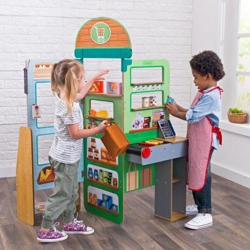 children playing with KidKraft Let’s Pretend™ Grocery Store Pop-Up
