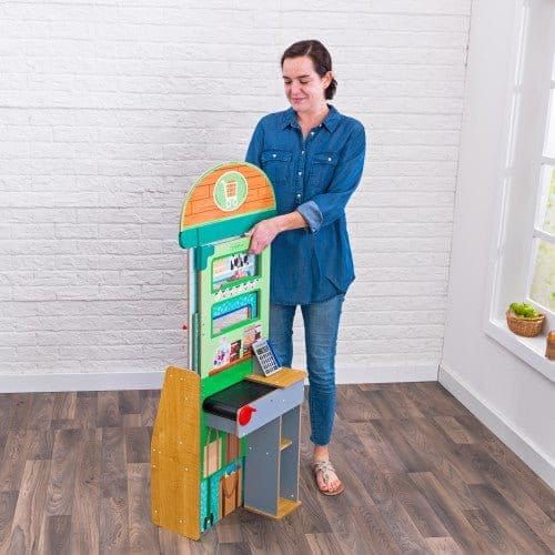 woman folding KidKraft Let’s Pretend™ Grocery Store Pop-Up