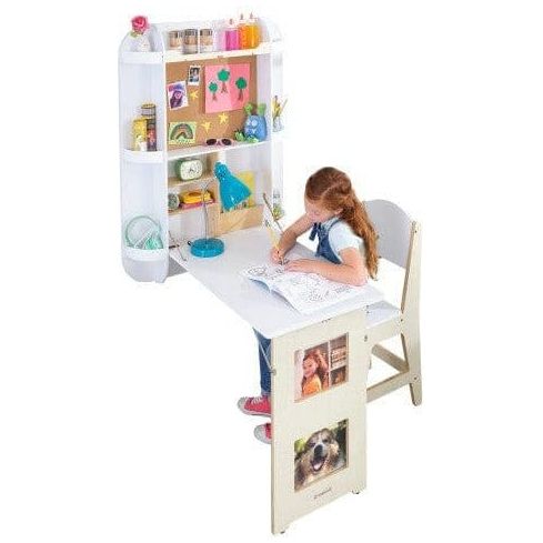 girl sitting and writing at KidKraft Arches Floating Wall Desk & Chair - White