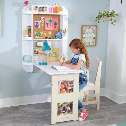 girl sitting at KidKraft Arches Floating Wall Desk & Chair - White