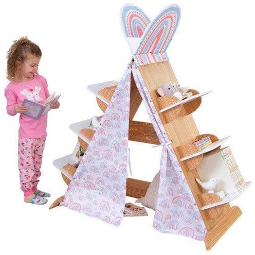 girl with book standing next to KidKraft Book Nook Tent with Shelves