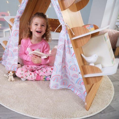 smiling girl reading book underneath KidKraft Book Nook Tent with Shelves