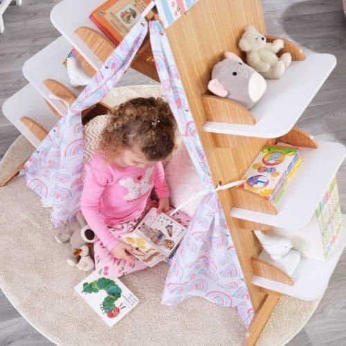 girl reading book underneath KidKraft Book Nook Tent with Shelves